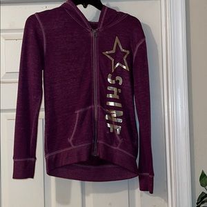 Burgundy Justice sweatsuit.